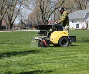 Wasson crew applying treatment to a lawn in spring