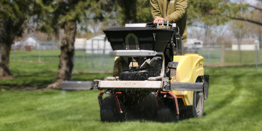 Wasson crew treating a lawn with fertilization and aeration