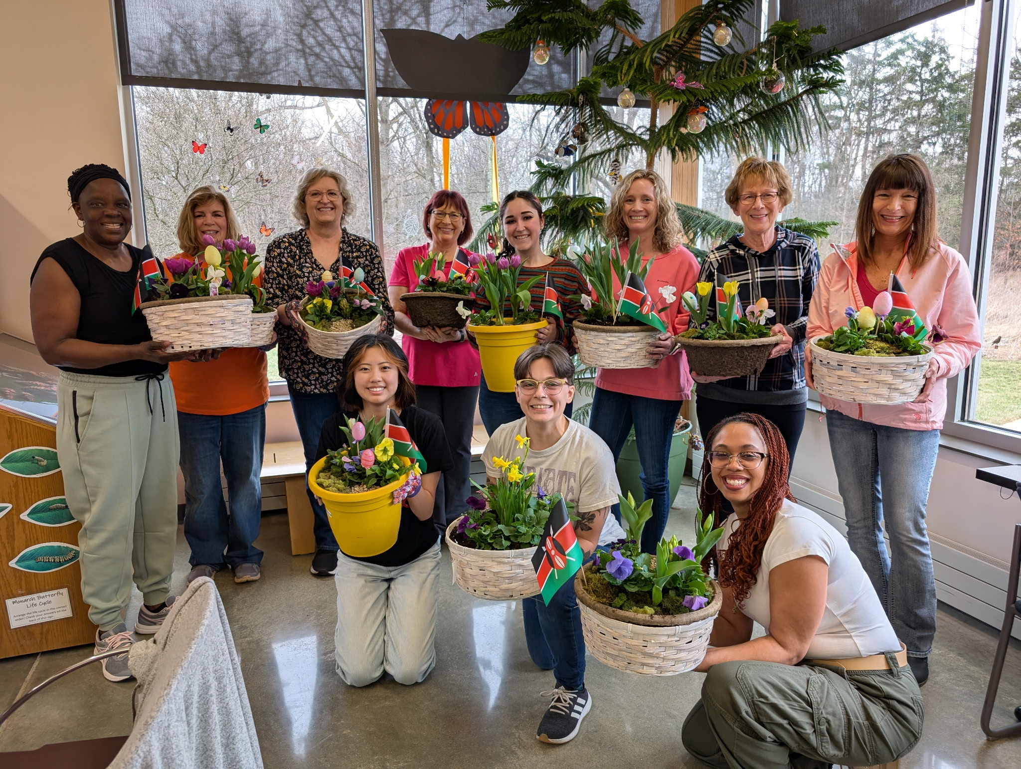 Group of women holding creations from a Wasson workshop